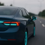 A modern blue electric car driving on an open road at dusk with turquoise lighting accents symbolising automated driving communication.